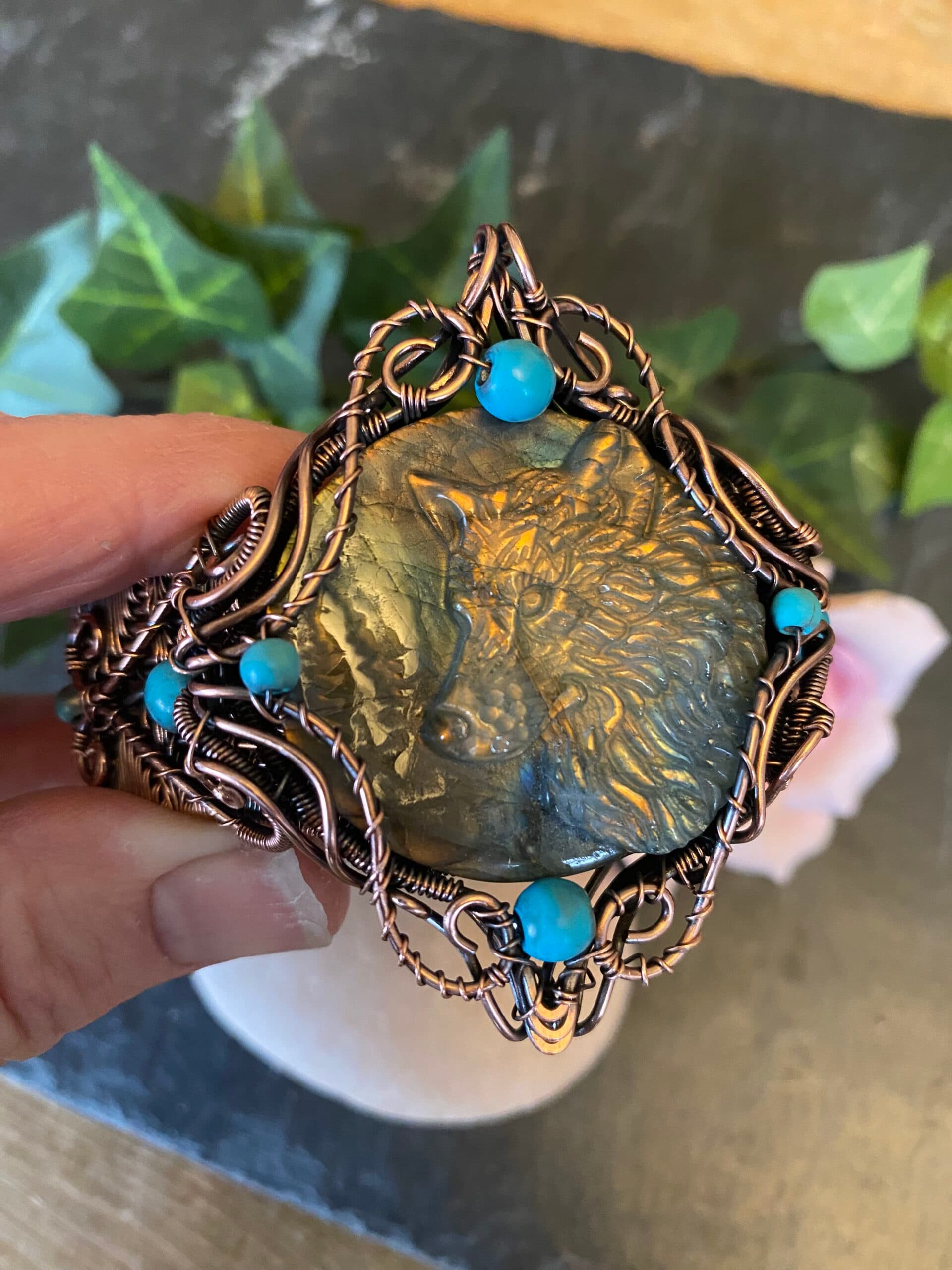 Handwoven copper wolf cuff bracelet with labradorite wolf head cabochon and turquoise beads Copper wolf cuff bracelet showing woven wire detail and antiqued finish Handwoven copper wolf bracelet with carved labradorite cabochon in blue and gold tones