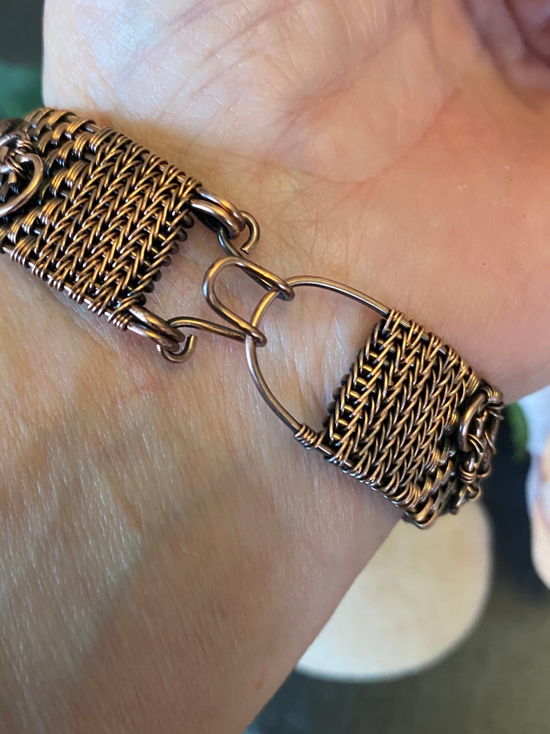 Handwoven copper pentagram cuff bracelet with hammered symbol and lapis lazuli beads Copper pentagram cuff bracelet showing woven wire detail and blue beads Handwoven copper cuff bracelet with antiqued pentagram and lapis accents