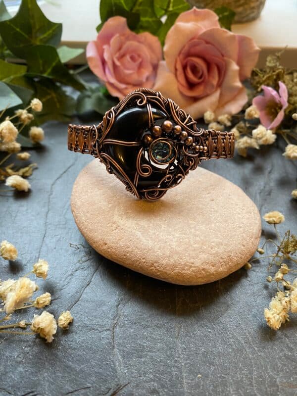 Handmade black onyx crescent moon cuff bracelet with copper chaos weave, Swarovski crystal and decorative wire scrollwork.