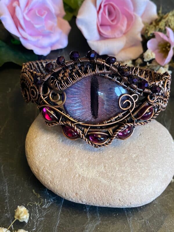 Handmade Flower Dragon Eye copper cuff bracelet featuring a pink-purple painted eye, vintage fuchsia glass cabochons and purple beads.