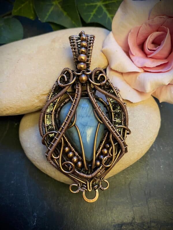 Tear-drop Australian Opal pendant with wire wrapping and woven bale