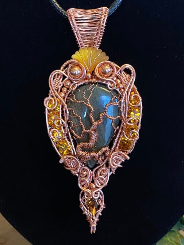 Handcrafted copper wire woven Tree of Life pendant with a labradorite cabochon, vintage Swarovski crystals, copper beads, and a detailed heady wrap design.