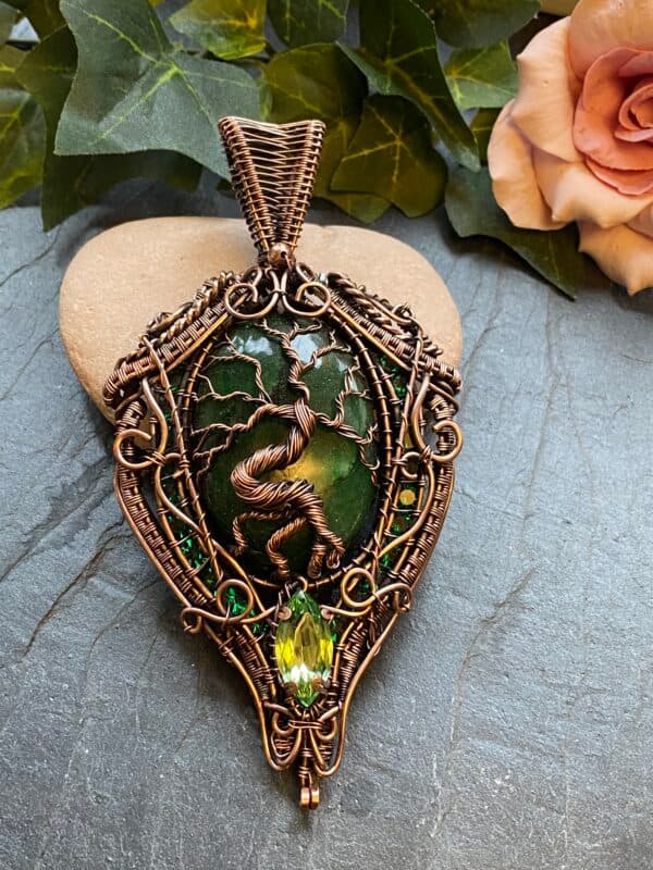 Brazilian emerald copper wire wrapped necklace with Tree of Life design Oval Brazilian emerald pendant with channel set Swarovski crystals Copper wire emerald statement necklace with vintage Swarovski gem Handwoven copper wire emerald necklace detail