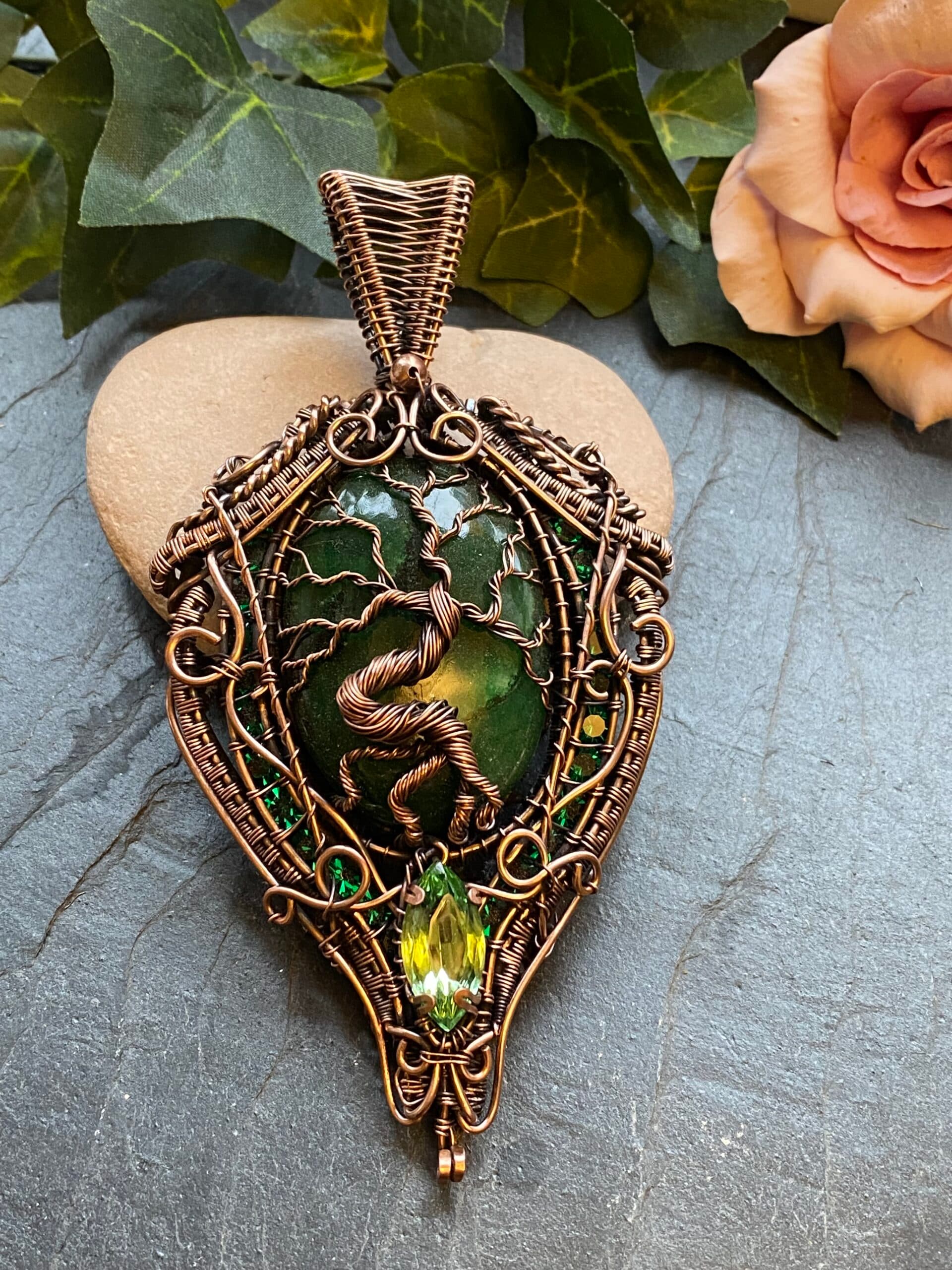 Brazilian emerald copper wire wrapped necklace with Tree of Life design Oval Brazilian emerald pendant with channel set Swarovski crystals Copper wire emerald statement necklace with vintage Swarovski gem Handwoven copper wire emerald necklace detail