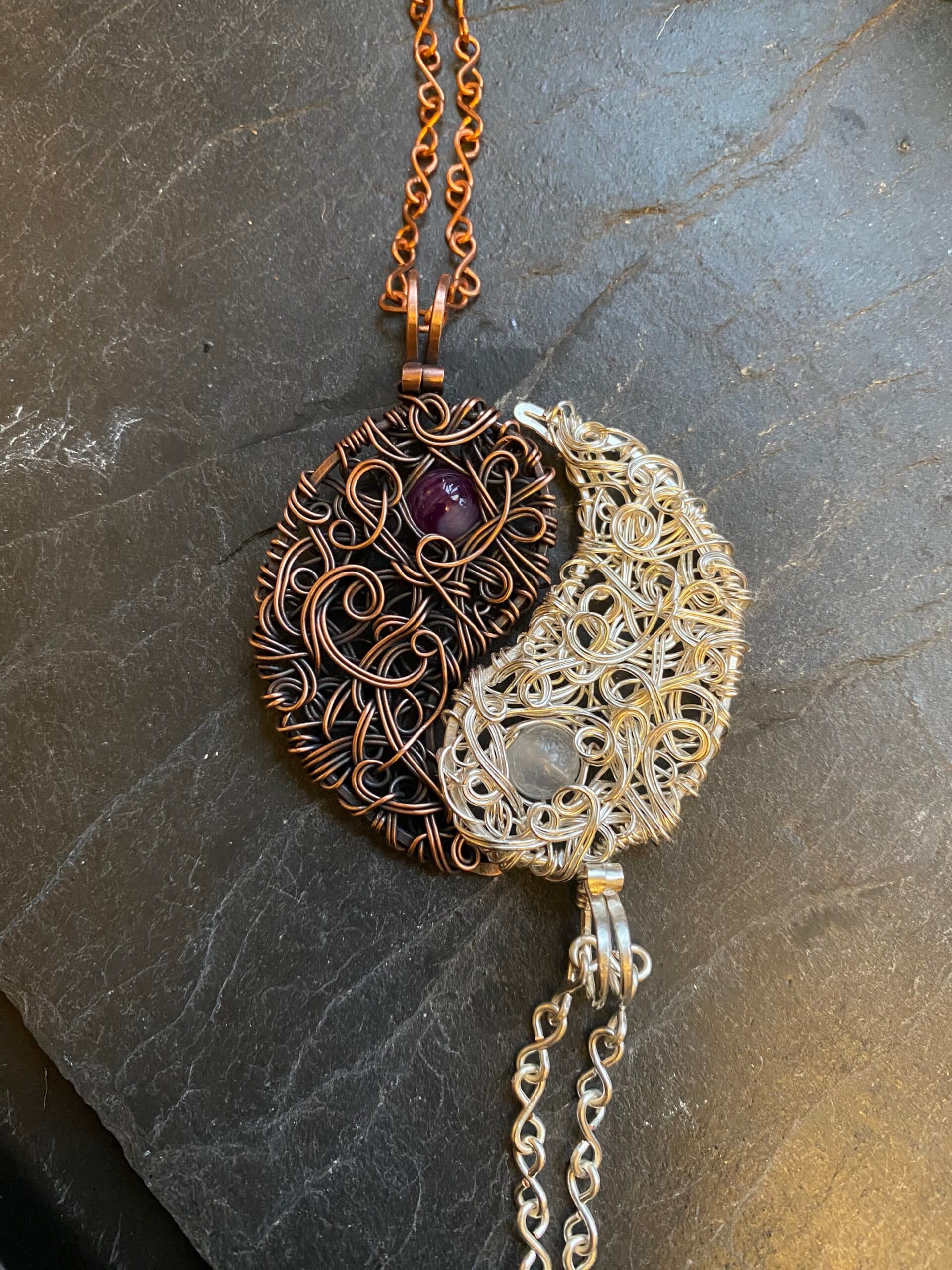 Handmade yin yang necklace set with copper amethyst pendant and silver moonstone pendant forming matching symbol jewelry