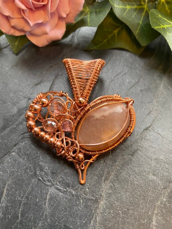 Copper wire wrapped heart pendant with peach moonstone and pink beads on handmade copper chain