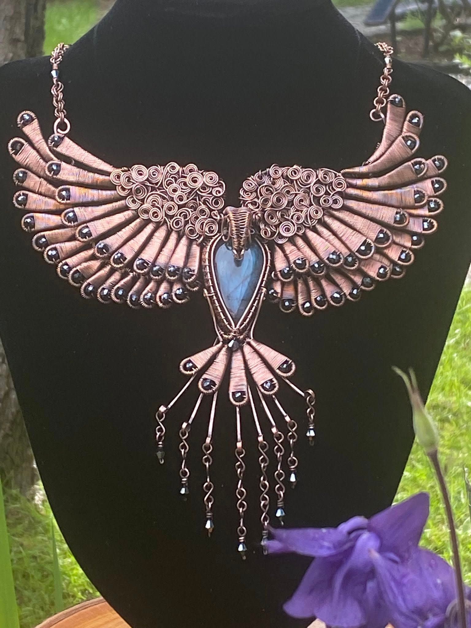 Viking Raven Necklace featuring Labradorite centre stone, black faceted beads, and intricate wire weaving inspired by Norse mythology.
