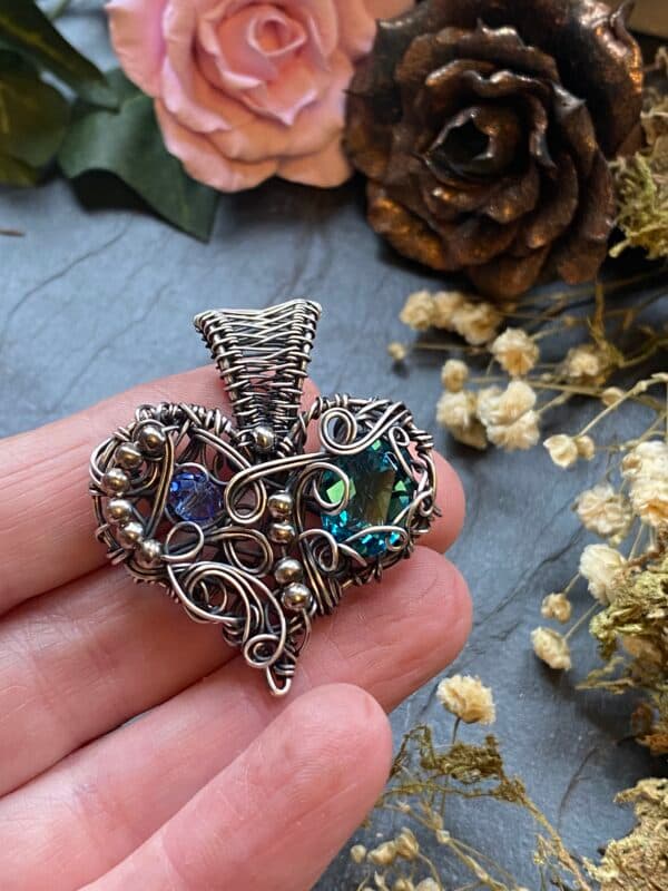 Handmade 10% silver filled wire Chaos Heart pendant with flowing silver swirls, silver coloured beads and a vintage Preciosa crystal