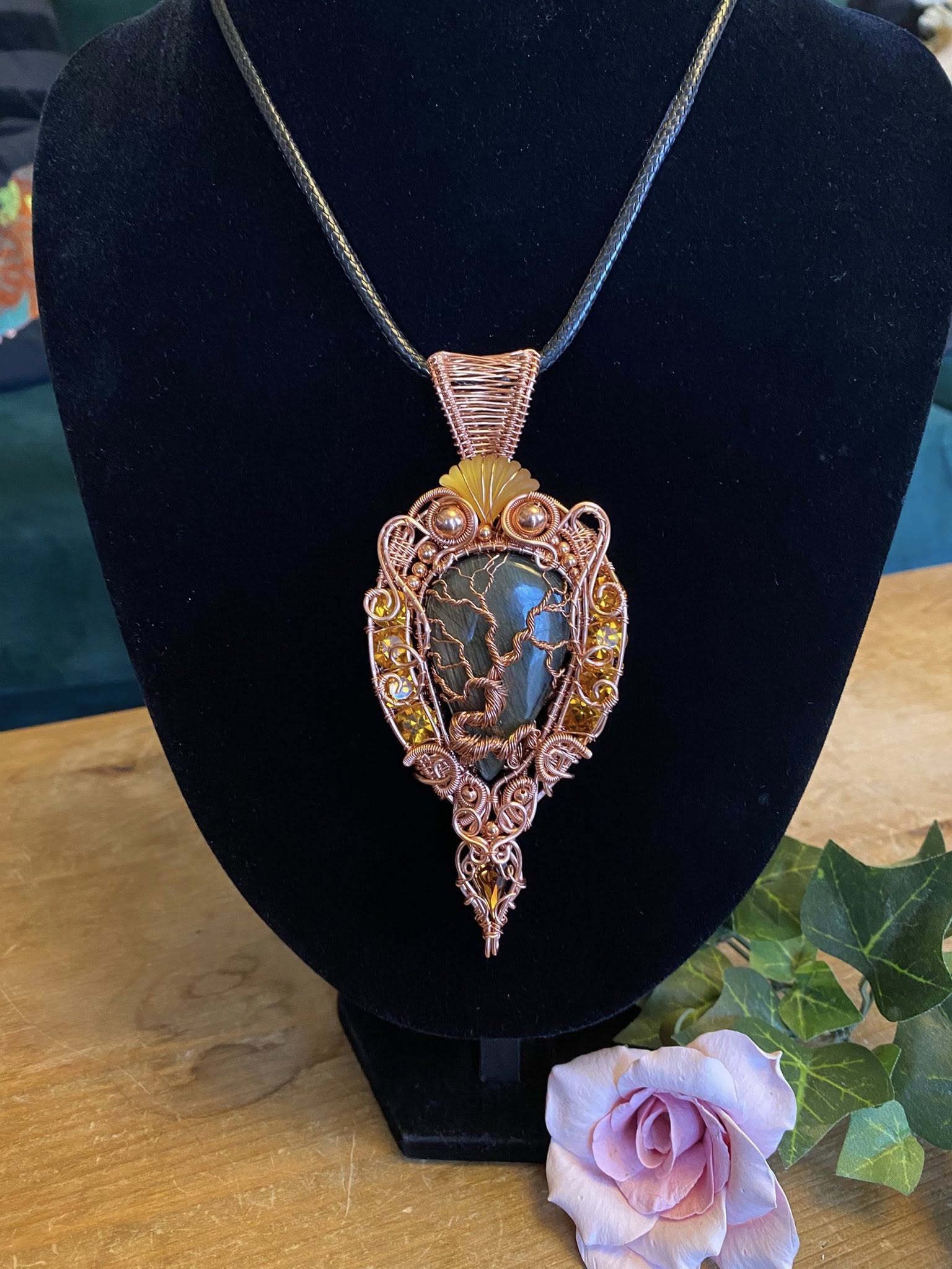 Handcrafted copper wire woven Tree of Life pendant with a labradorite cabochon, vintage Swarovski crystals, copper beads, and a detailed heady wrap design.