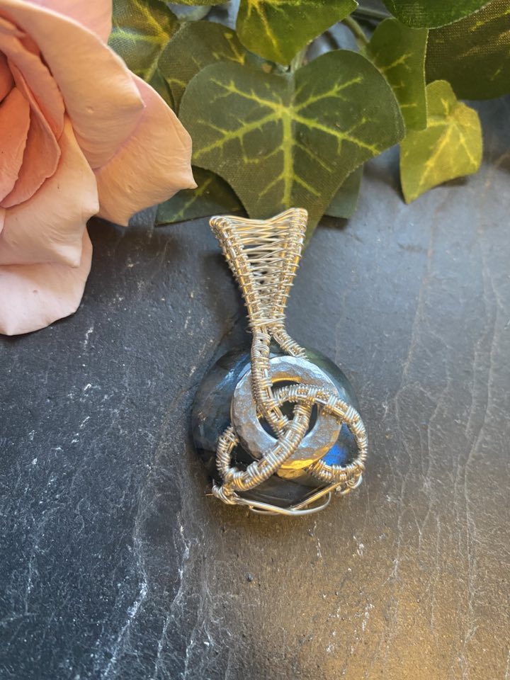 Handmade labradorite pendant with bright blue flash, wrapped in 10% silver filled wire in a Celtic knot design around a stainless steel core.
