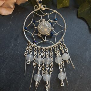 Handmade silver filled wire wrapped dreamcatcher pendant with rainbow moonstone cabochon, blue glass beads, and moonstone bead fringe.