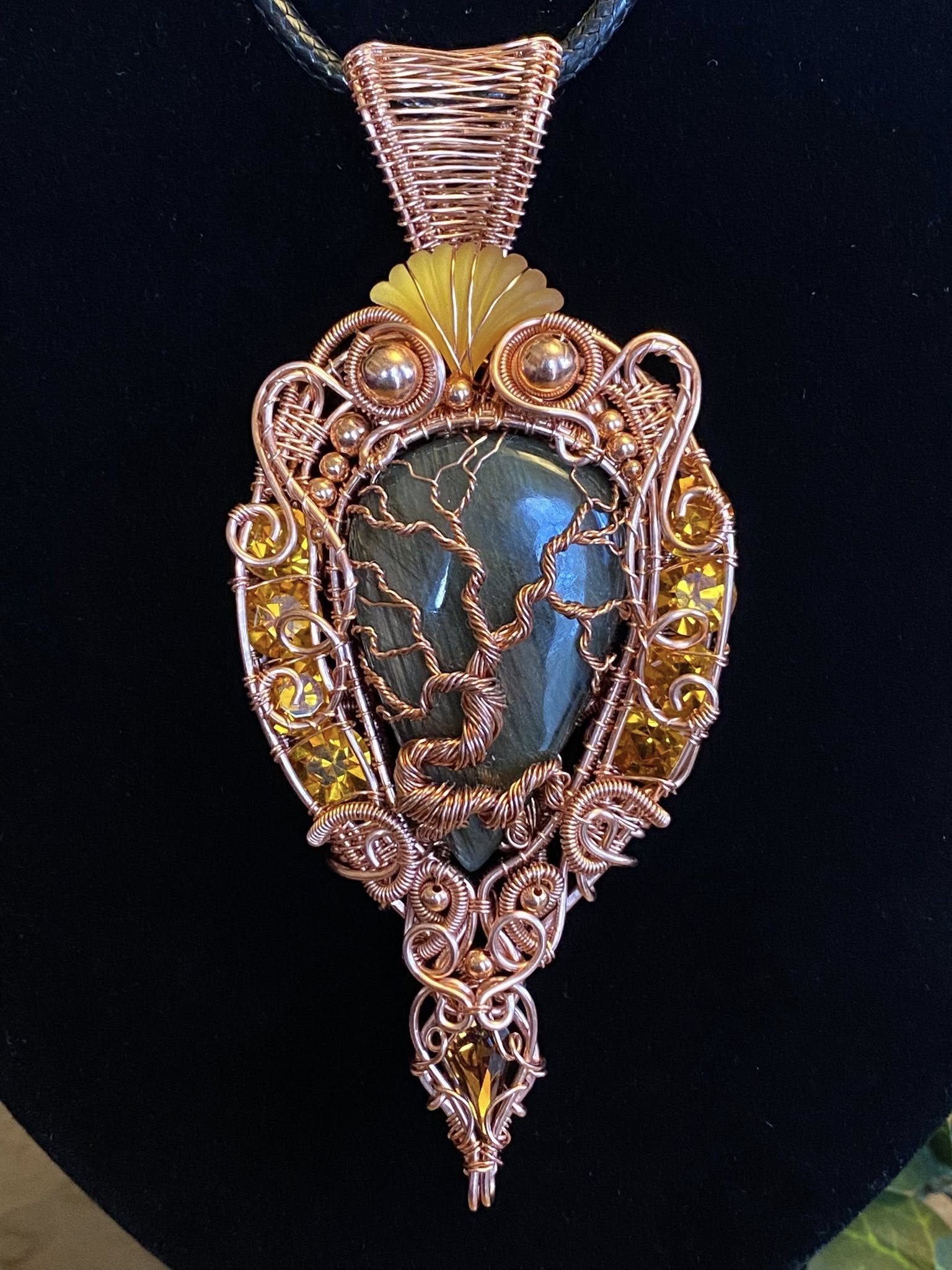 Handcrafted copper wire woven Tree of Life pendant with a labradorite cabochon, vintage Swarovski crystals, copper beads, and a detailed heady wrap design.