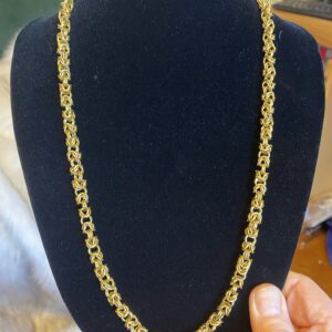 Handmade brass Byzantine chain necklace with woven bale clasp Brass Byzantine chain showing hand-coiled wire detail Handwoven V-shaped brass bale clasp for interchangeable pendants