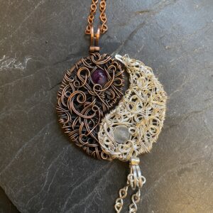 Handmade yin yang necklace set with copper amethyst pendant and silver moonstone pendant forming matching symbol jewelry