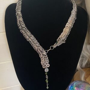 Handmade dragon scale silver plated necklace with layered wire links and green bead detail