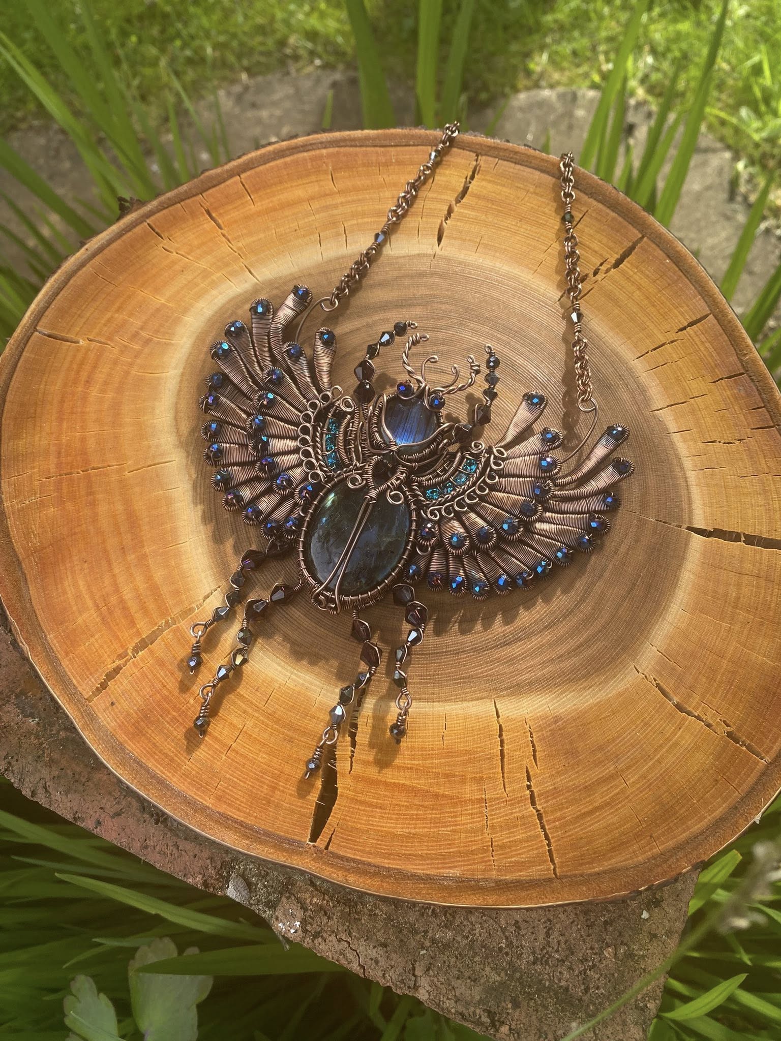 Handcrafted wire woven scarab beetle statement necklace with Labradorite cabochons and Swarovski crystals inspired by Ancient Egyptian mythology.
