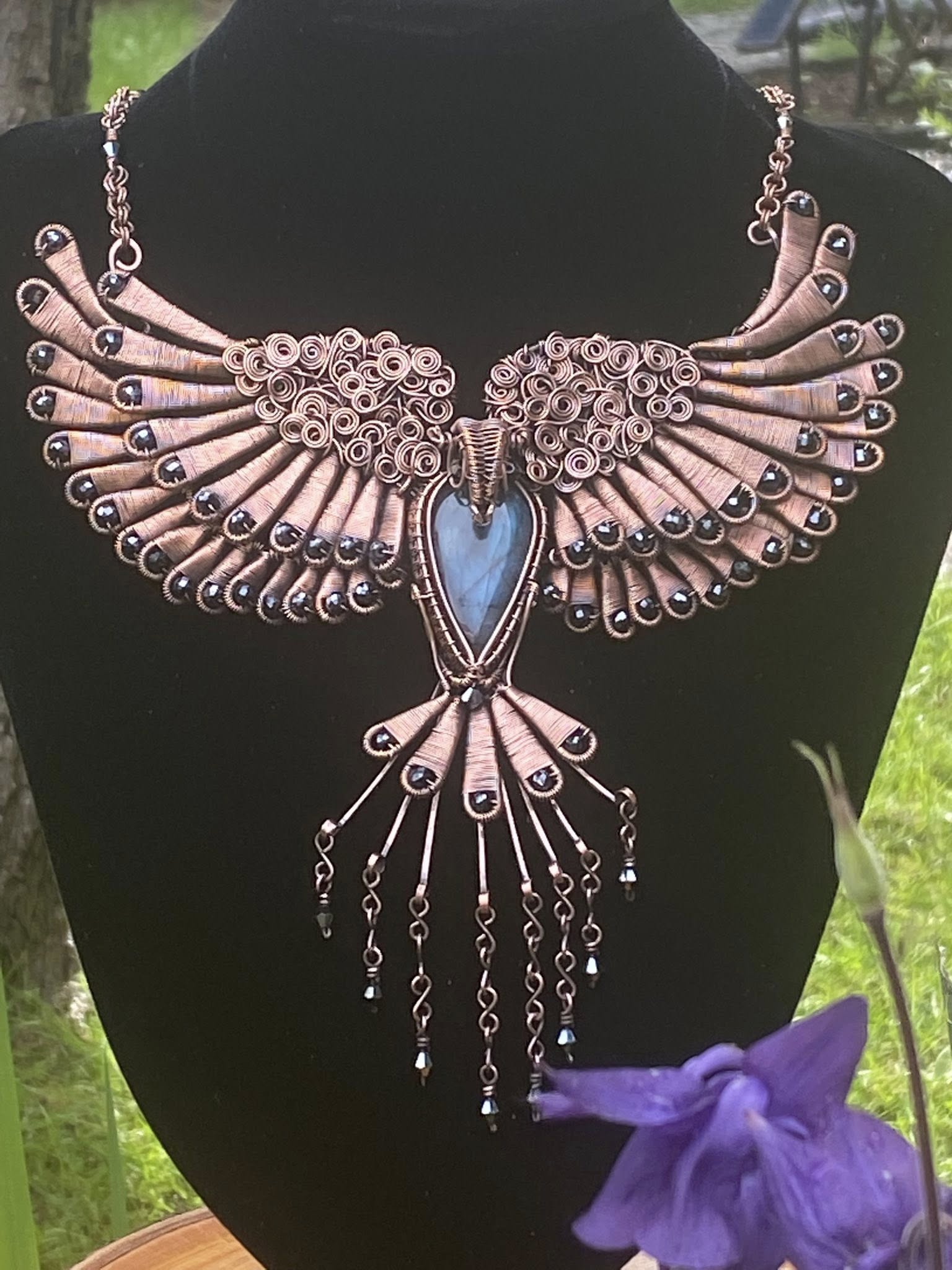 Viking Raven Necklace featuring Labradorite centre stone, black faceted beads, and intricate wire weaving inspired by Norse mythology.
