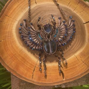 Handcrafted wire woven scarab beetle statement necklace with Labradorite cabochons and Swarovski crystals inspired by Ancient Egyptian mythology.
