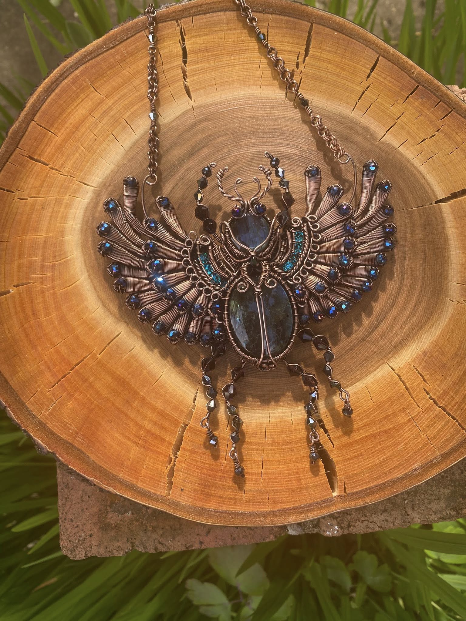 Handcrafted wire woven scarab beetle statement necklace with Labradorite cabochons and Swarovski crystals inspired by Ancient Egyptian mythology.