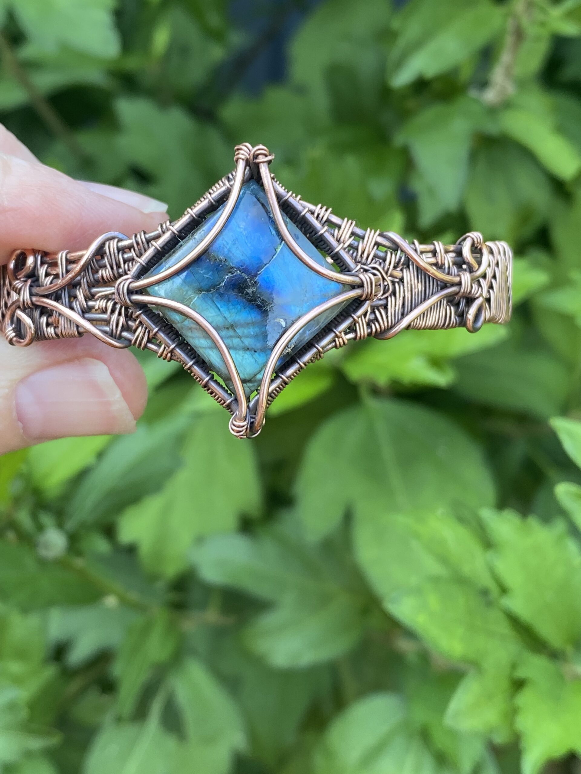 Handmade Labradorite copper cuff bracelet with green and blue flash gemstone and seven strand woven copper band